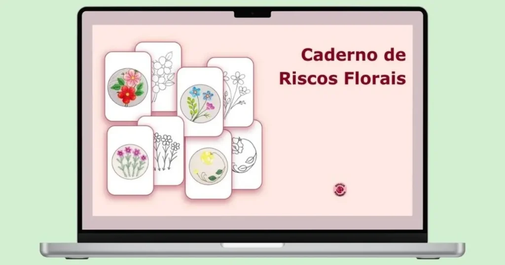 laptop aberto com a capa do ebook "caderno de riscos florais - rosália rosarinha", com o título em destaque e riscos e bordados à mão