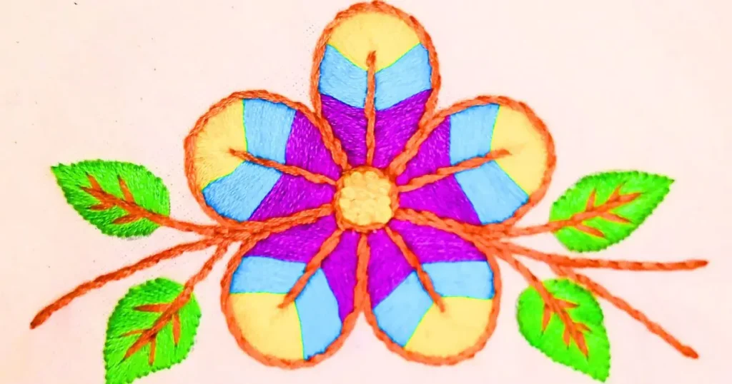 flor colorida bordada em com ponto cheio e ponto haste. criado pela artesã andrea catão para o canal rosália rosarinha